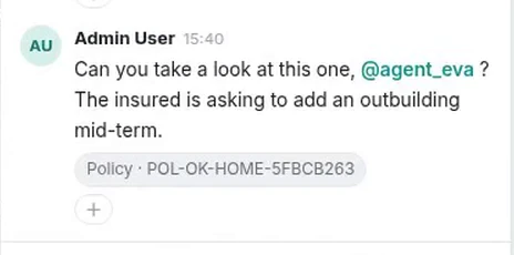 The sent message carrying a mention and a policy chip underneath it