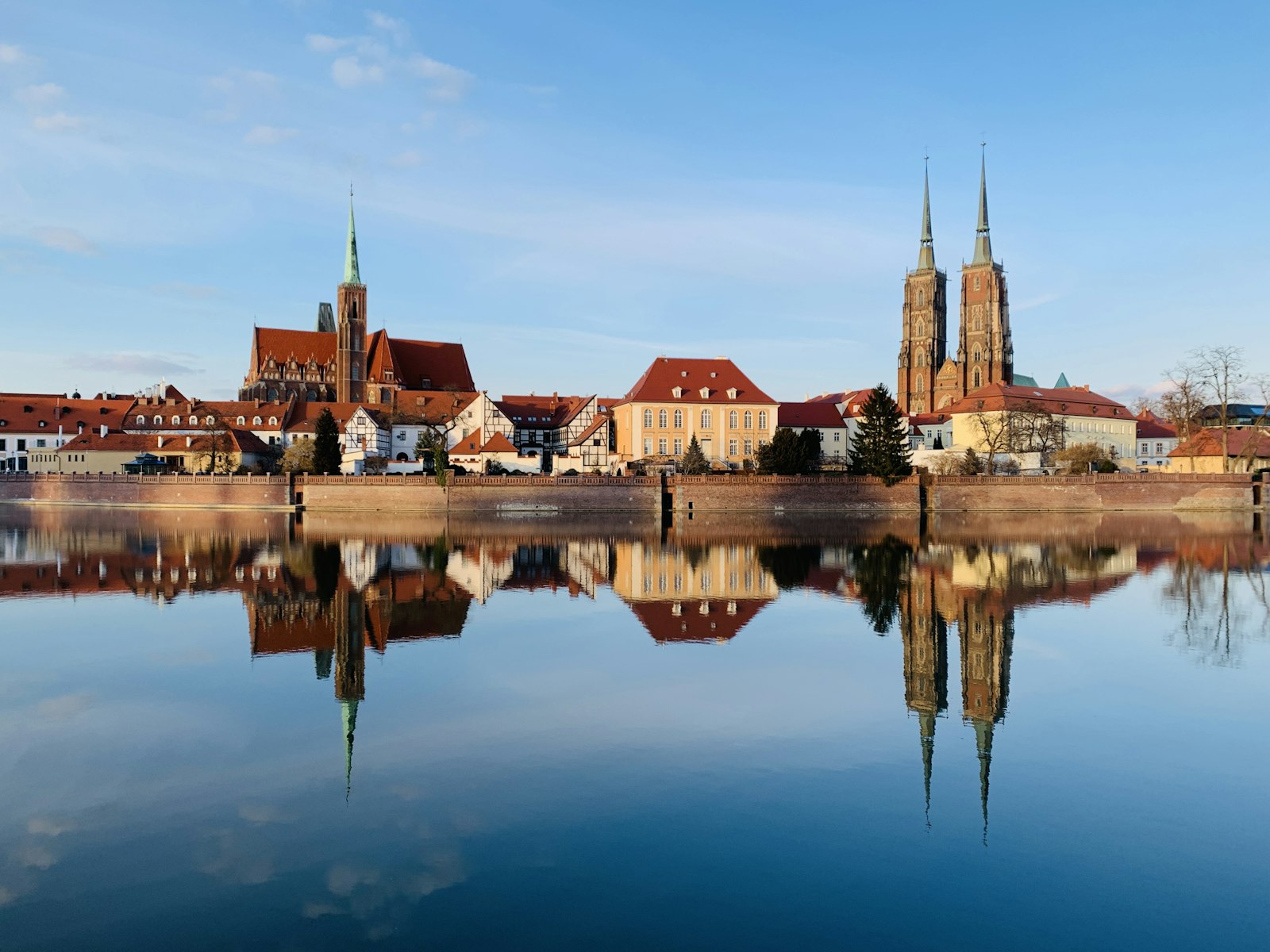 Ostrów Tumski and the twin spires of Wrocław Cathedral reflected in the Odra river